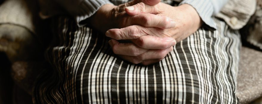 Hands of elderly woman clapsed