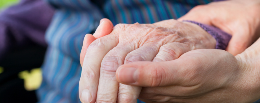 Hands holding in wheelchair