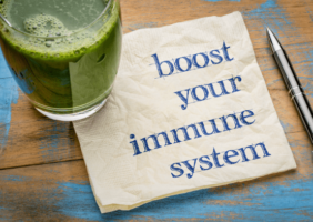 Glass of green juice with immune boosting note