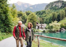 Elderly couple walking by the lake