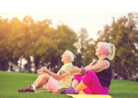 Elderly couple enjoying yoga outside