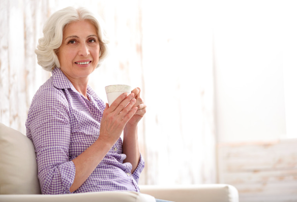 elderly woman drinking tea