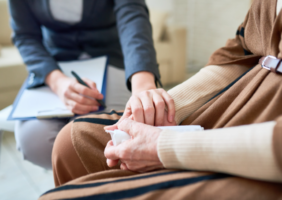 Carer talking to elderly woman