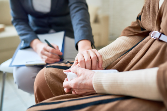 Carer talking to elderly woman