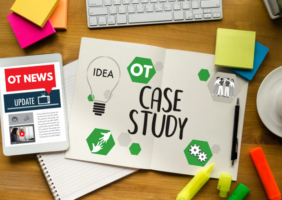 Office supplies and news article on an OT Case Study