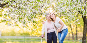 Elderly woman and young woman enjoying the spring blooms