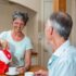 Elderly Man and Woman enjoying a cup of tea together